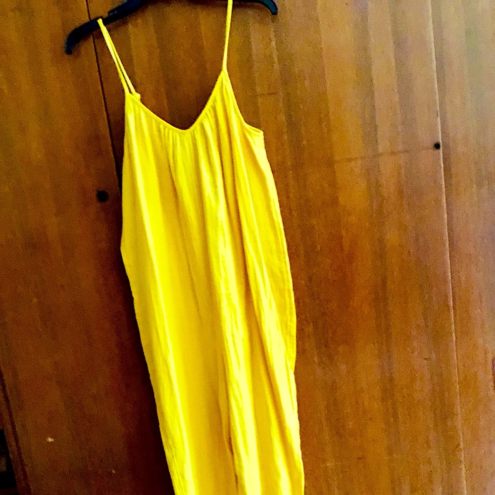 Summery bright yellow linen jumpsuit.